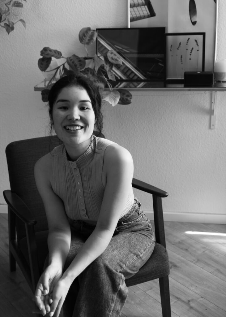 portrait of a female entrepreneur sitting in her design studio black and white brand photo